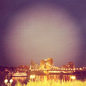 The Delta Queen steamboat, and a view of the city at night.